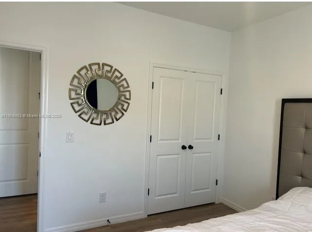 a view of a room that has a lot of cabinets