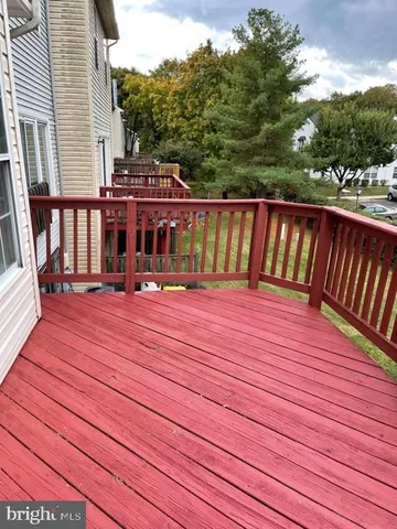a balcony with view of trees in the background