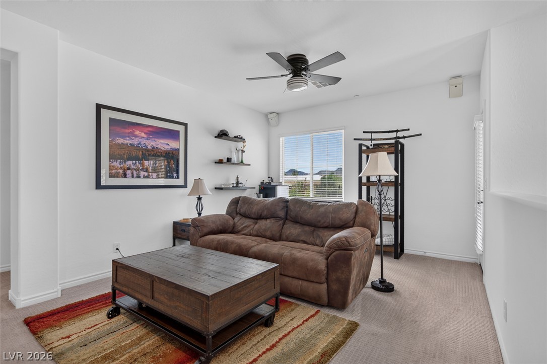 1824 Redland Ridge Street Henderson, NV 89002 - Photo 30 of 69 Comfortable living area offering a serene vista of distant mountains from the window.