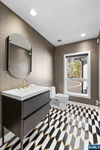 a large kitchen with stainless steel appliances lots of counter space cabinets and a sink