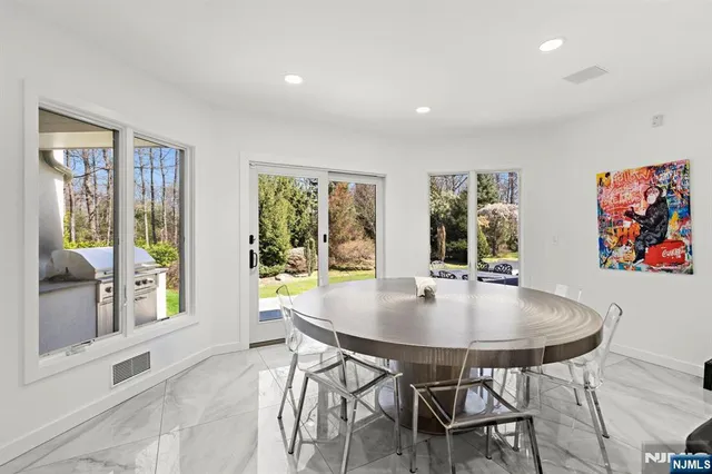 a kitchen with stainless steel appliances a refrigerator sink and cabinets
