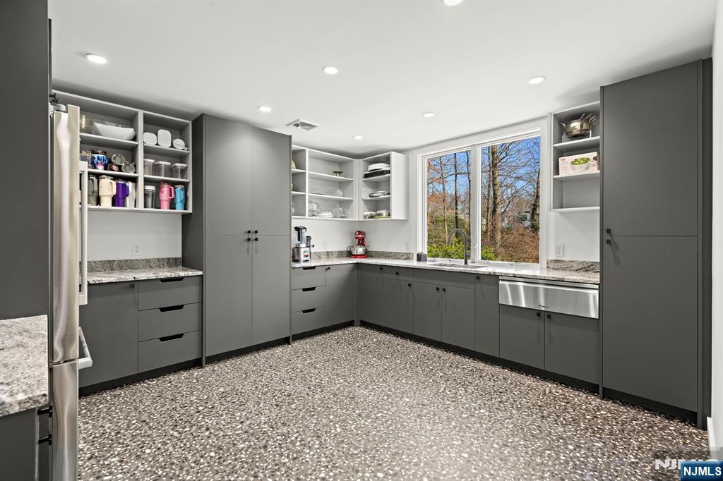 425 Highview Road Englewood, NJ 07631 - Photo 16 of 48 a kitchen with stainless steel appliances a refrigerator sink and cabinets