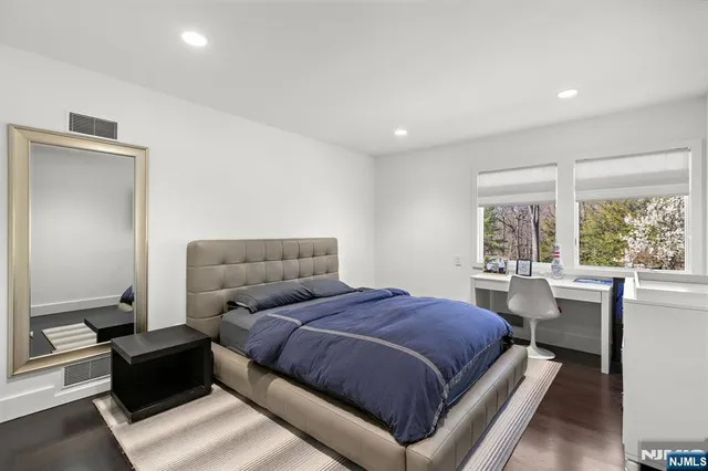 a bath tub sitting next to a bathroom sink
