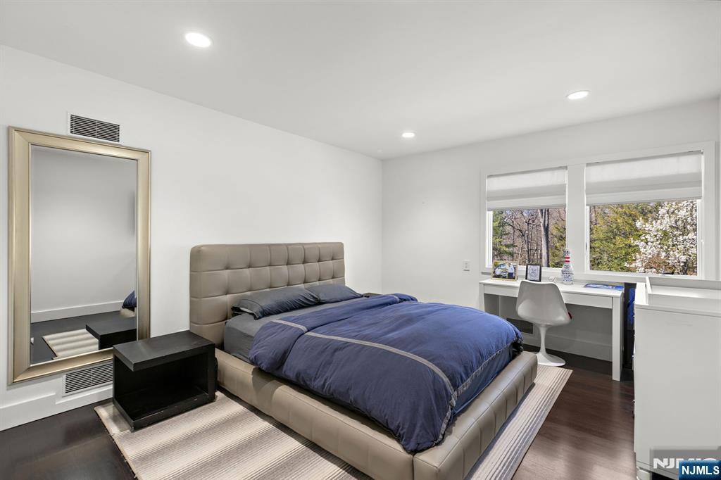 425 Highview Road Englewood, NJ 07631 - Photo 20 of 48 a bedroom with a large bed and windows
