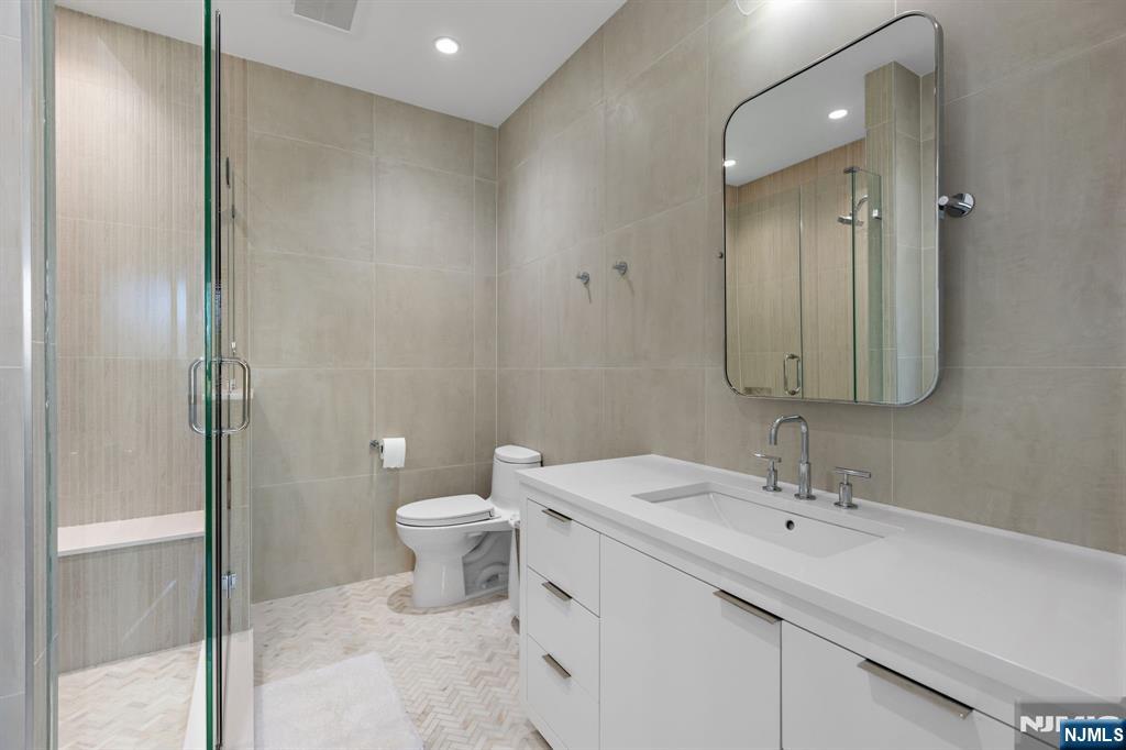 425 Highview Road Englewood, NJ 07631 - Photo 23 of 48 a bathroom with a sink toilet and shower