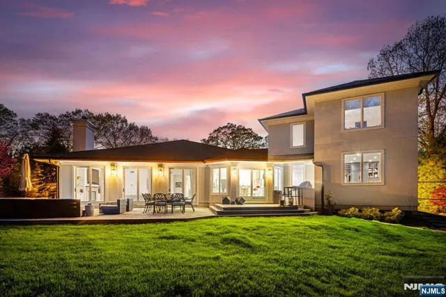 a front view of house with yard and outdoor seating