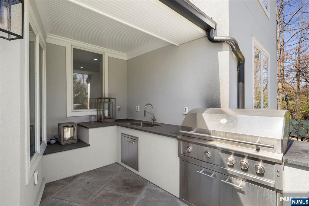 425 Highview Road Englewood, NJ 07631 - Photo 34 of 48 a kitchen with a stove and a sink