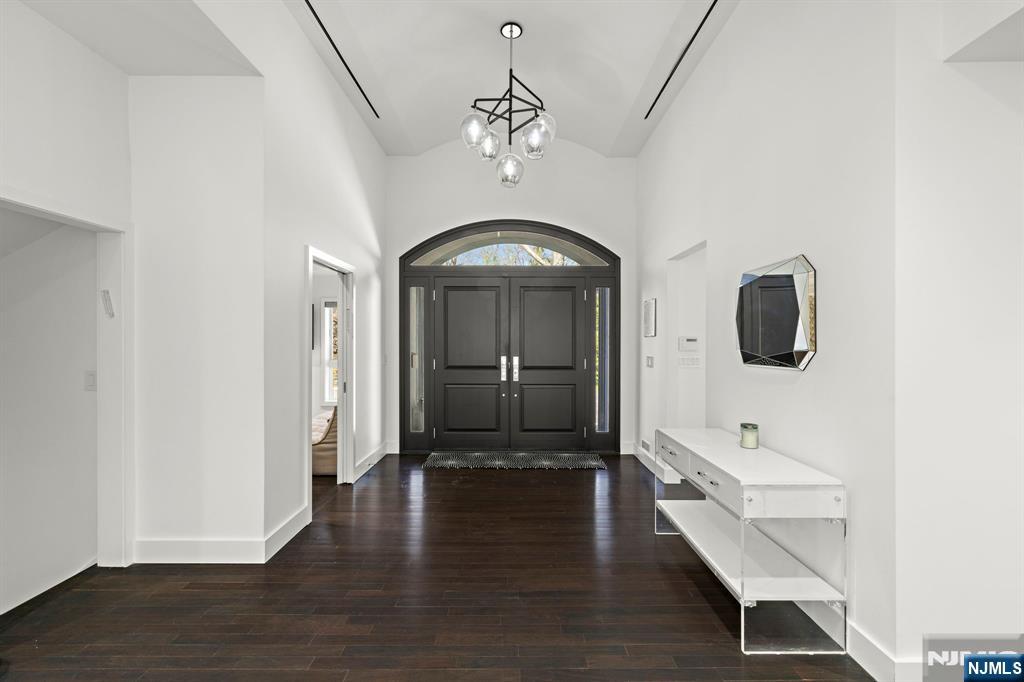 425 Highview Road Englewood, NJ 07631 - Photo 4 of 48 a view of a hallway with wooden floor and staircase