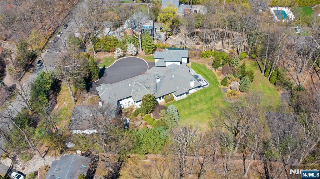 425 Highview Road Englewood, NJ 07631 - Photo 41 of 48 a aerial view of a house with swimming pool and large trees
