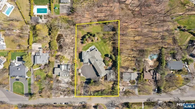 a front view of house with yard swimming pool and outdoor seating