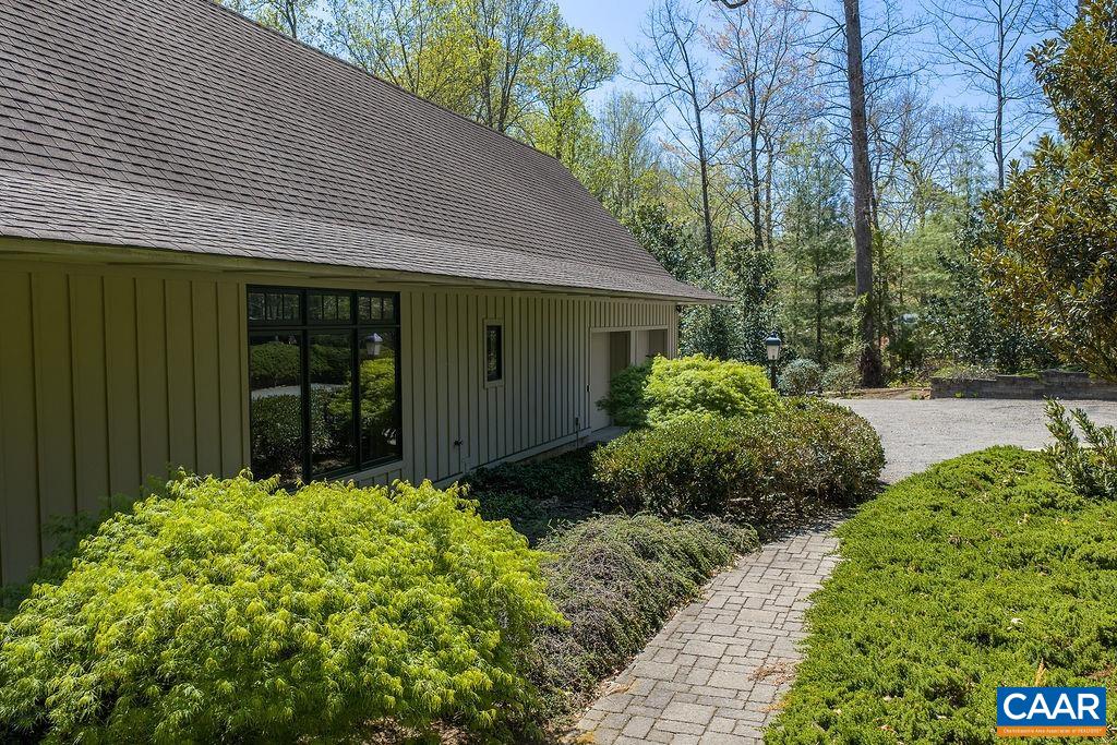 889 Old Garth Road Charlottesville, VA 22901 - Photo 8 of 35 a front view of a house with garden