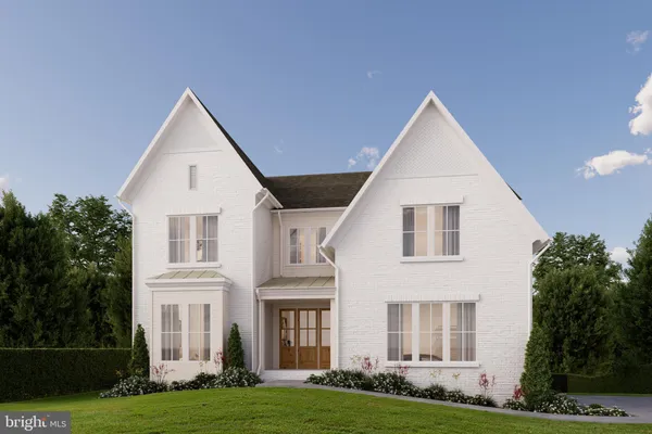 a view of white house with a yard
