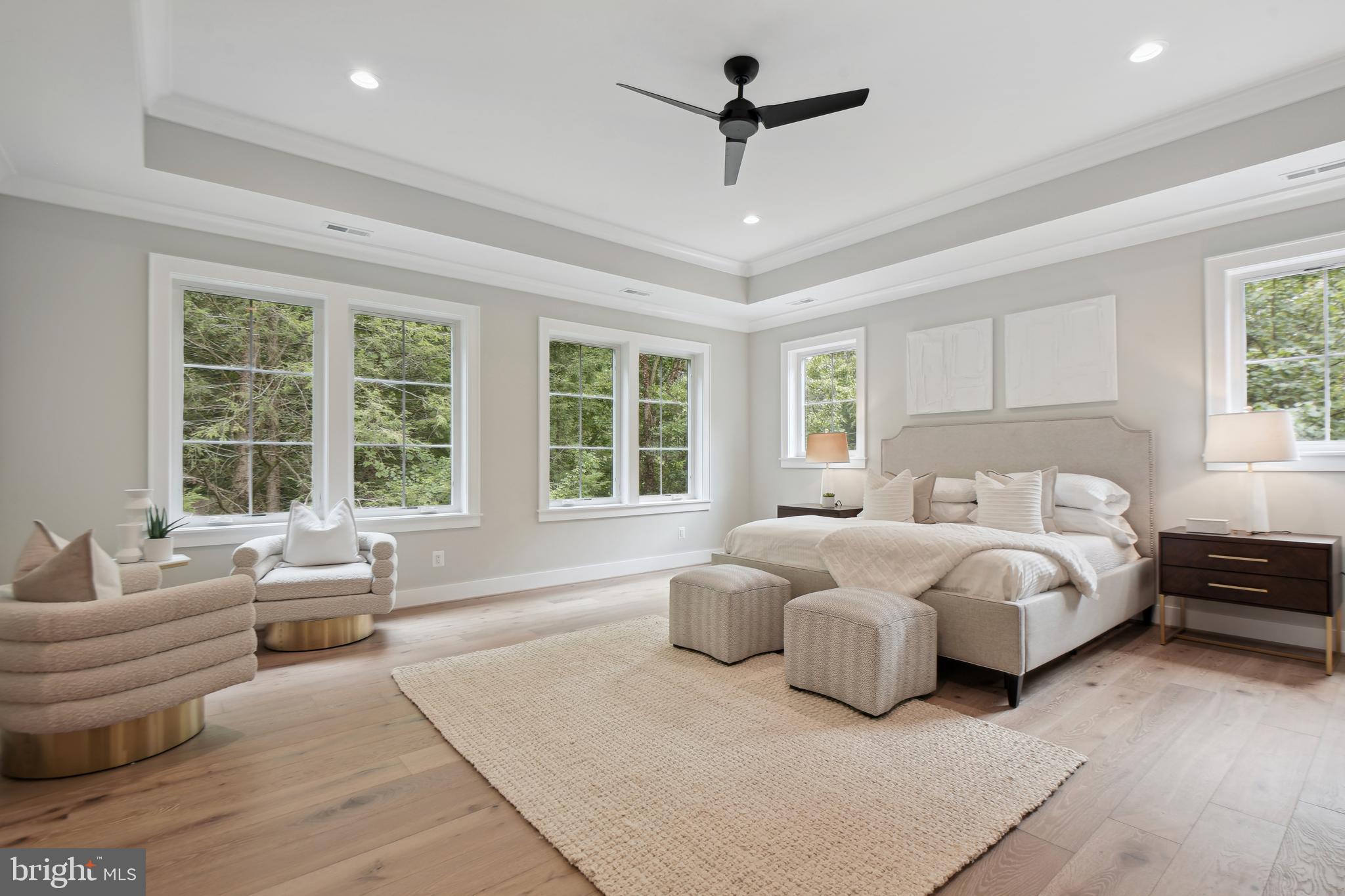 6523 Old Chesterbrook Road McLean, VA 22101 - Photo 9 of 17 a spacious bedroom with a large bed and a large window
