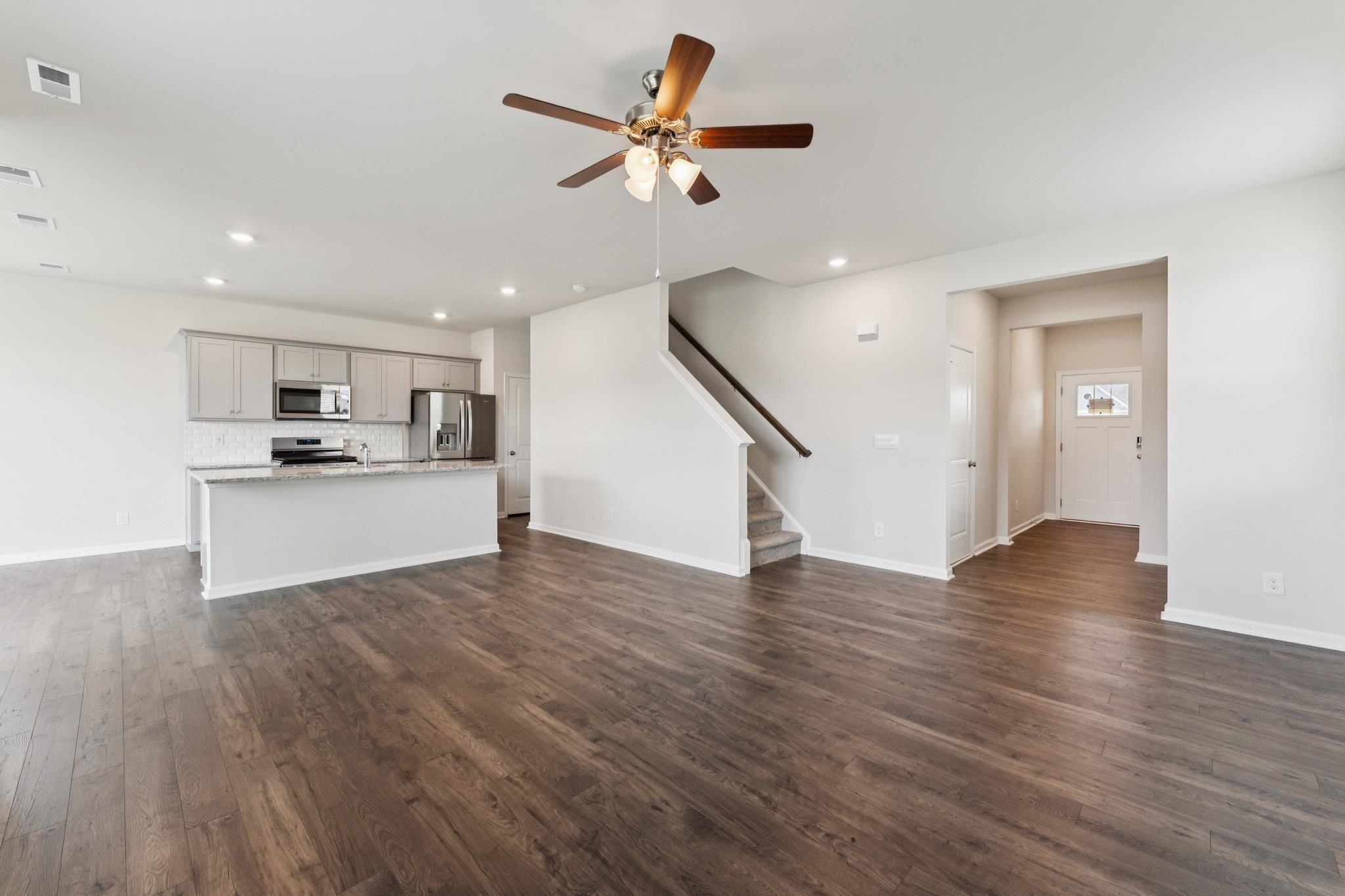 120 Meadow Ridge Way Staunton, VA 24401 - Photo 12 of 33 a view of a kitchen with wooden floor and a ceiling fan