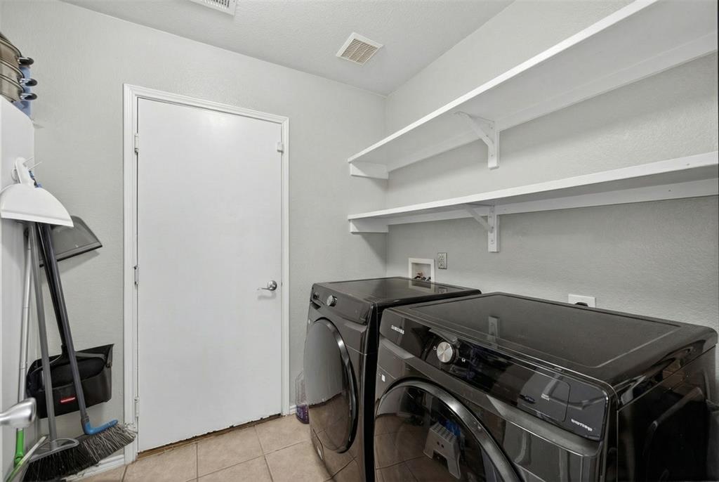 9633 Anns Way Plano, TX 75025 - Photo 32 of 37 a utility room with dryer and washer