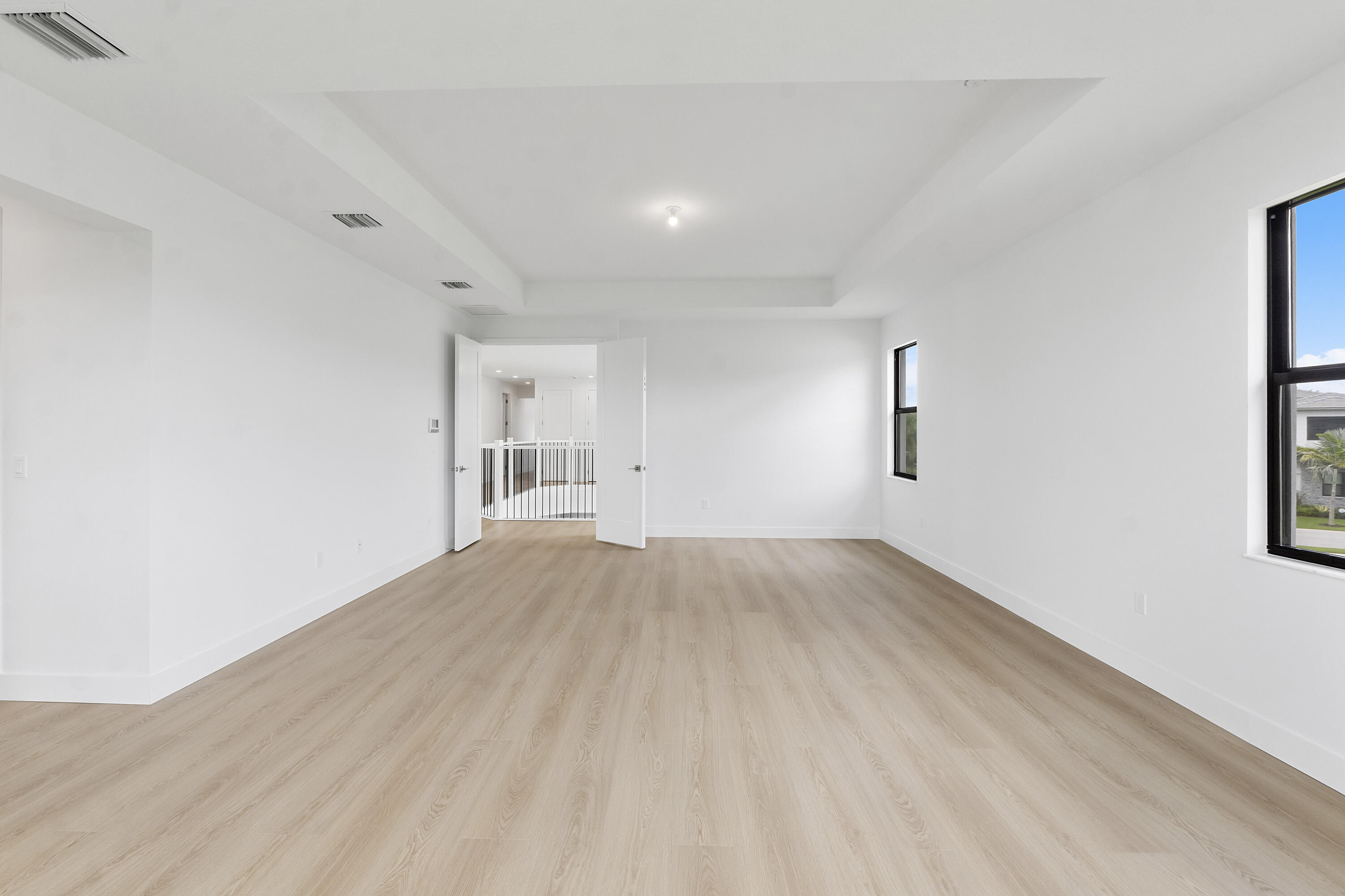 9322 Sunflower Mdw Road Boca Raton, FL 33434 - Photo 32 of 87 a view of empty room with wooden floor and fan