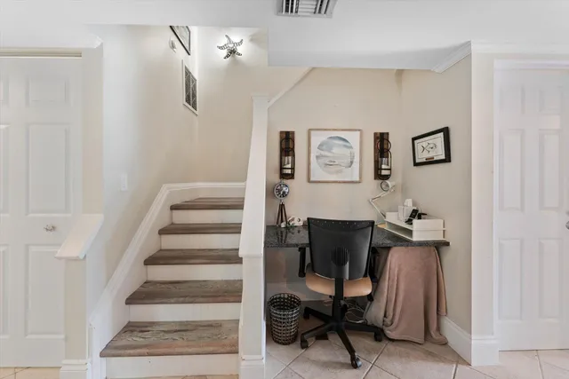 a view of a livingroom with furniture and workspace