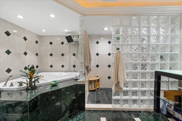 a bathroom with a sink a mirror and a shower