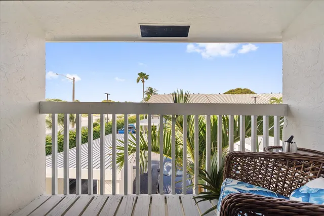 a view of a balcony with wooden floor