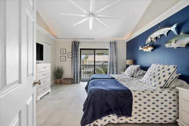 a spacious bedroom with a bed a couch and dresser