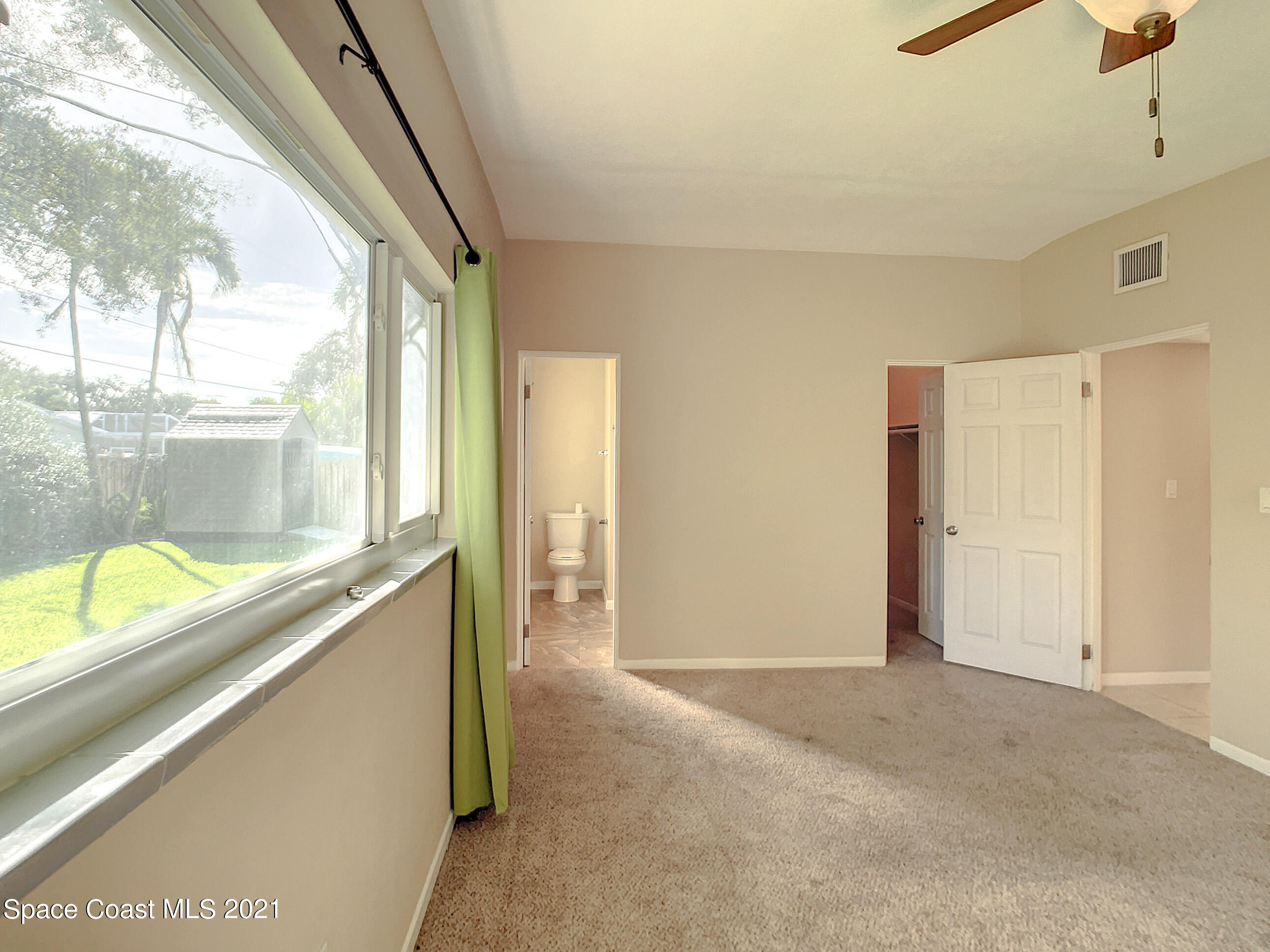 946 Santa Cruz Road Cocoa Beach, FL 32931 - Photo 17 of 26 a view of a kitchen with a large window