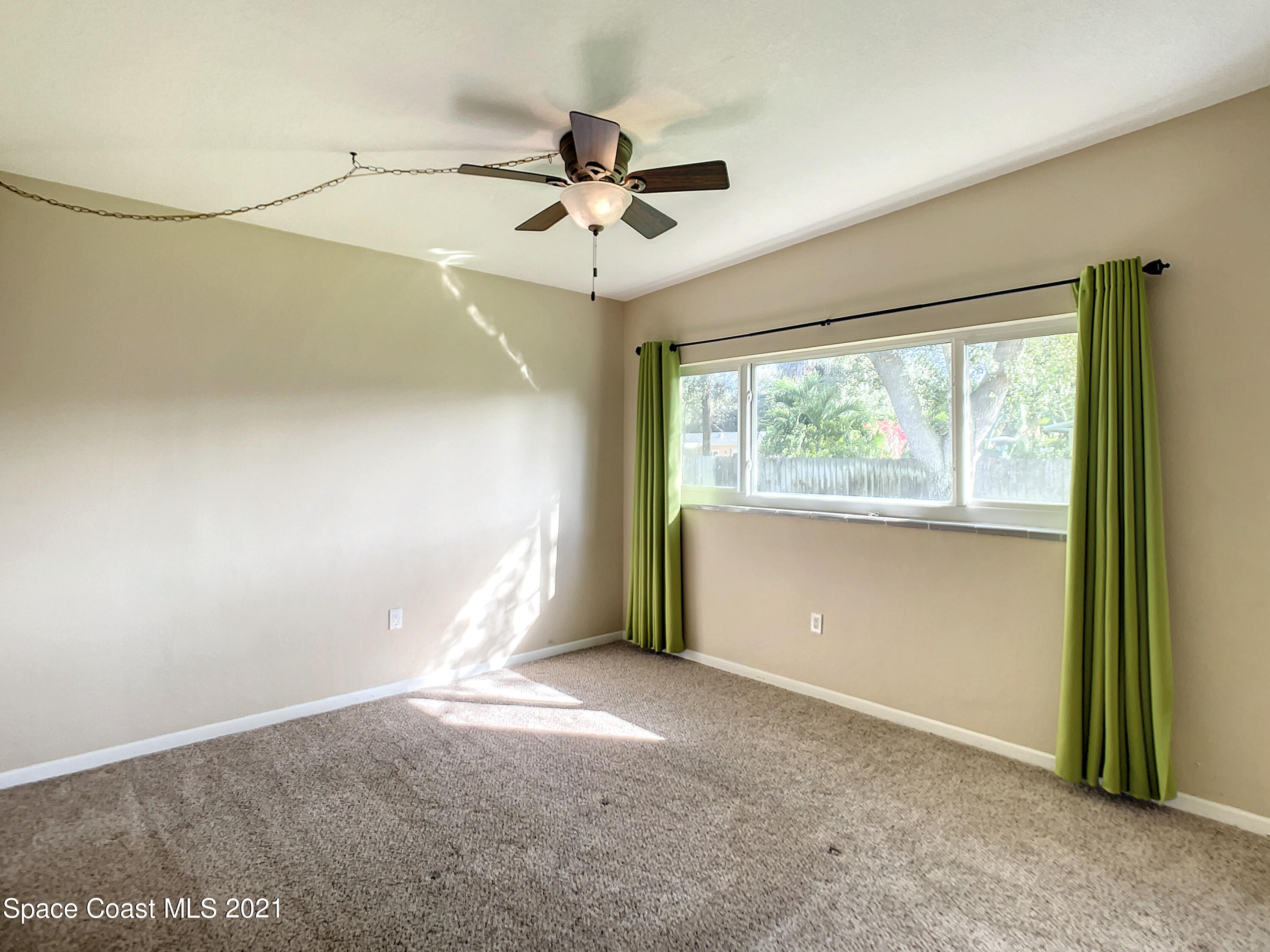 946 Santa Cruz Road Cocoa Beach, FL 32931 - Photo 18 of 26 a view of a room with a large window