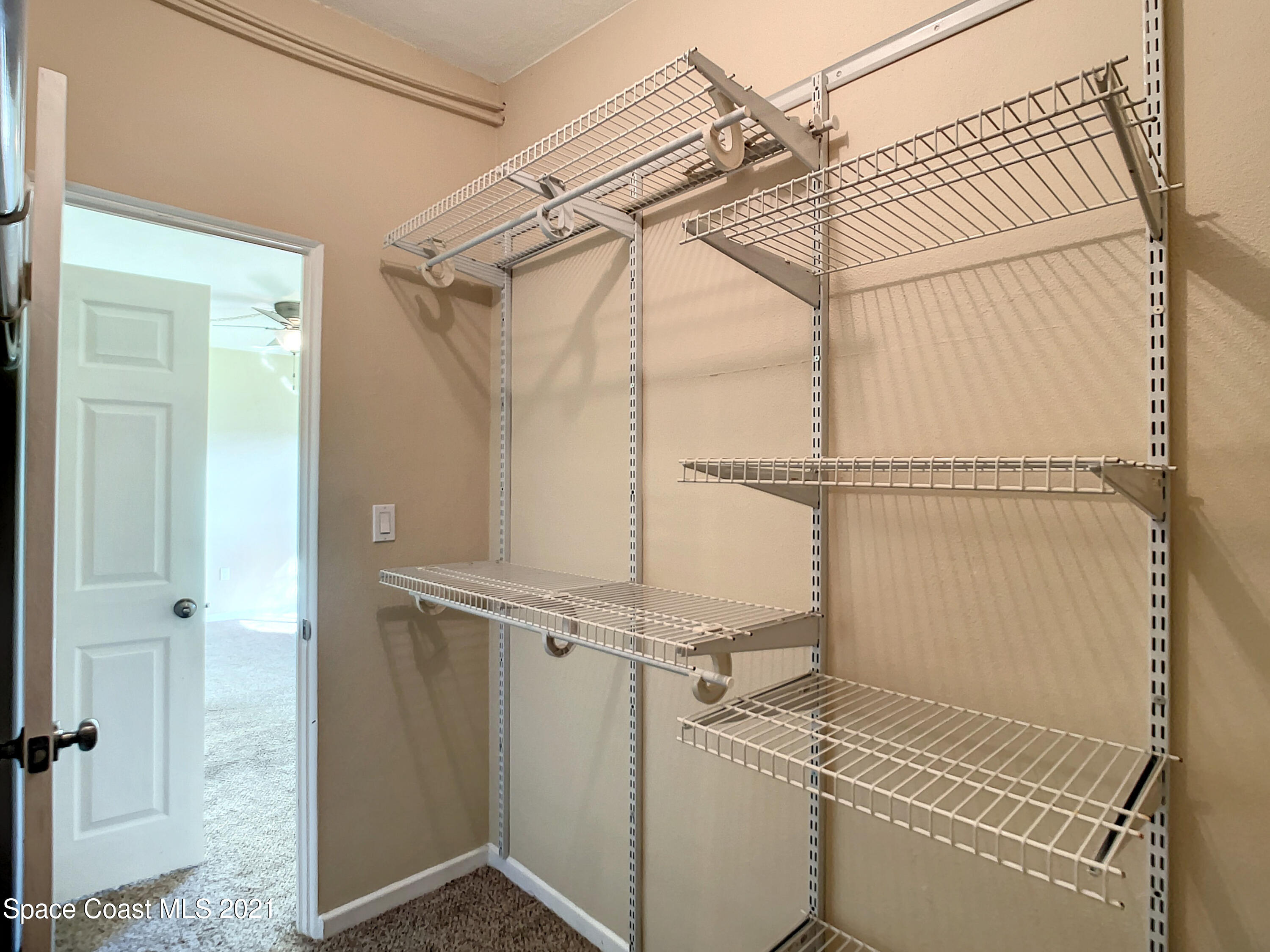 946 Santa Cruz Road Cocoa Beach, FL 32931 - Photo 19 of 26 an empty room with windows