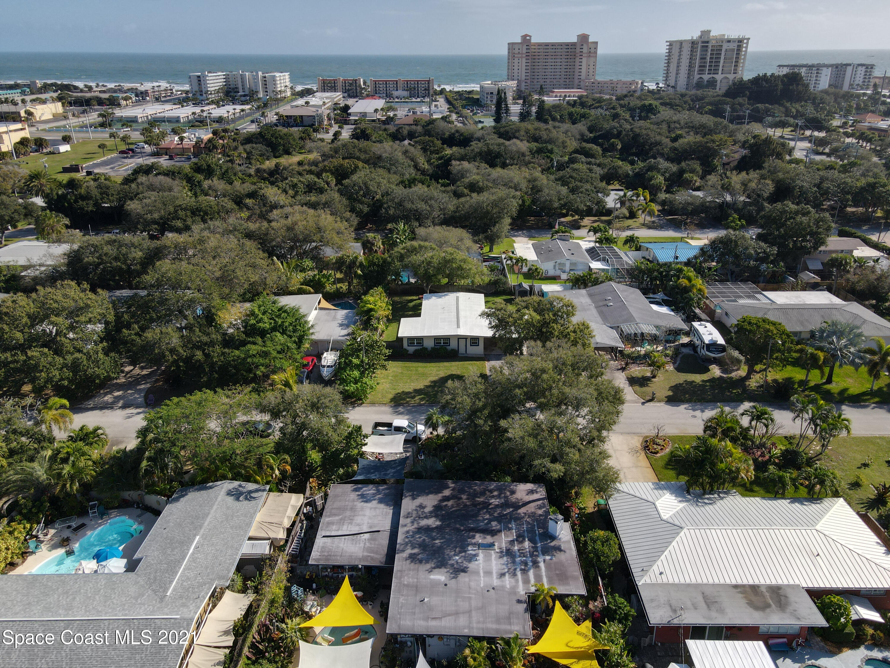 946 Santa Cruz Road Cocoa Beach, FL 32931 - Photo 2 of 26 an aerial view of residential houses with outdoor space