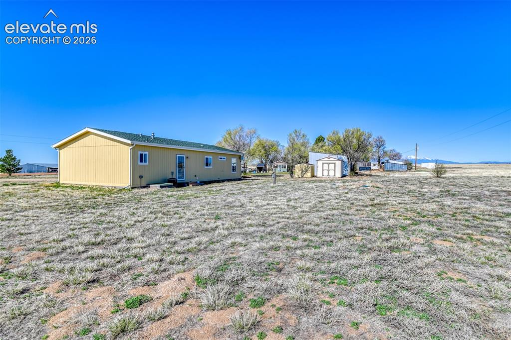 22558 Enoch Road Calhan, CO 80808 - Photo 23 of 50 a view of a house with a yard