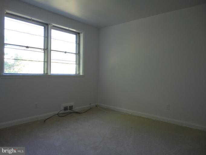 1810 Ingram Road Baltimore, MD 21239 - Photo 14 of 15 an empty room with a window