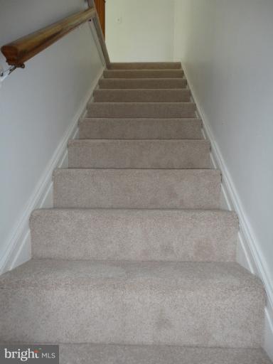 1810 Ingram Road Baltimore, MD 21239 - Photo 8 of 15 a view of staircase with white walls