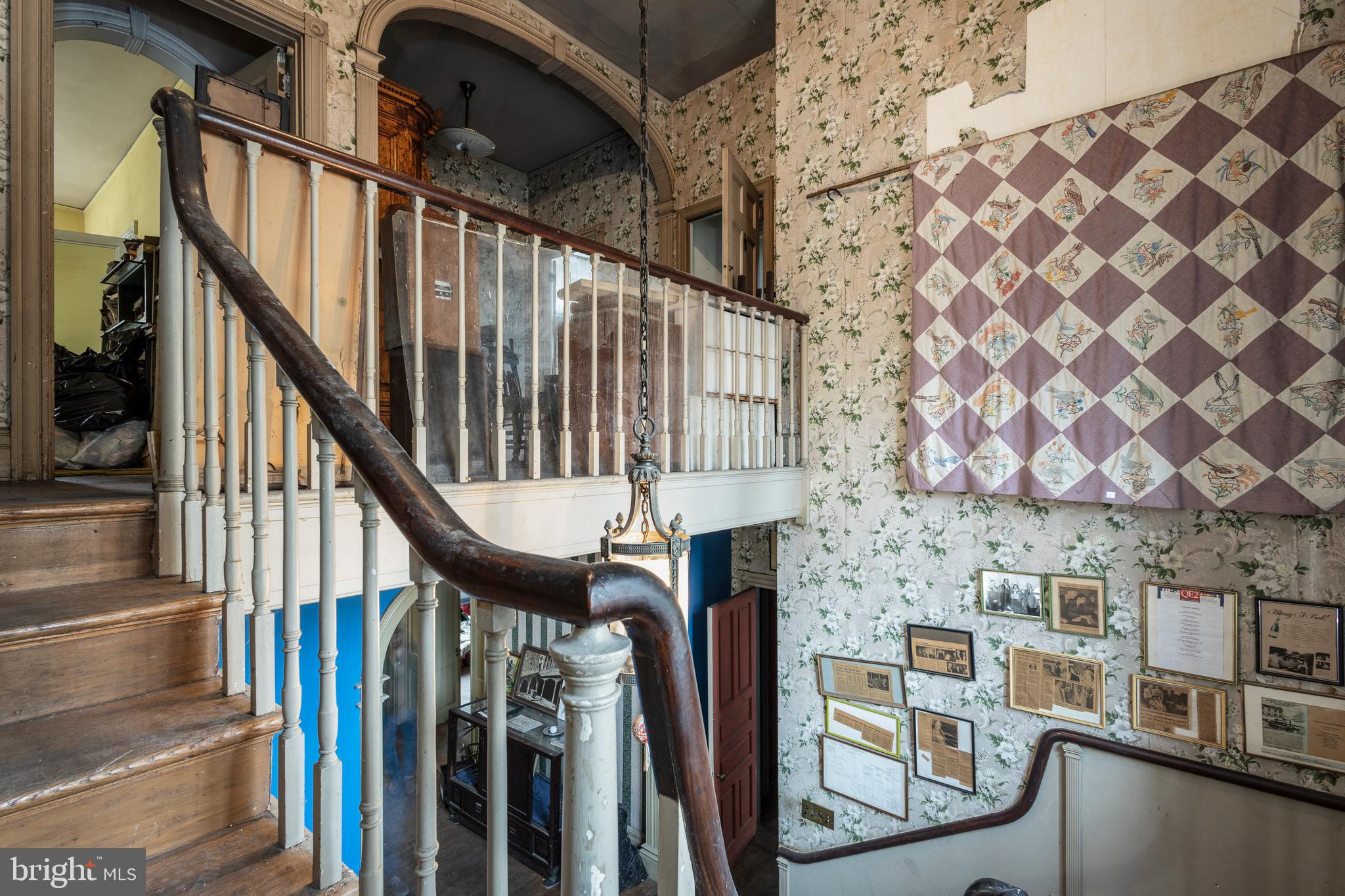 8221 Seminole Street Philadelphia, PA 19118 - Photo 17 of 20 a view of staircase with railing and white walls
