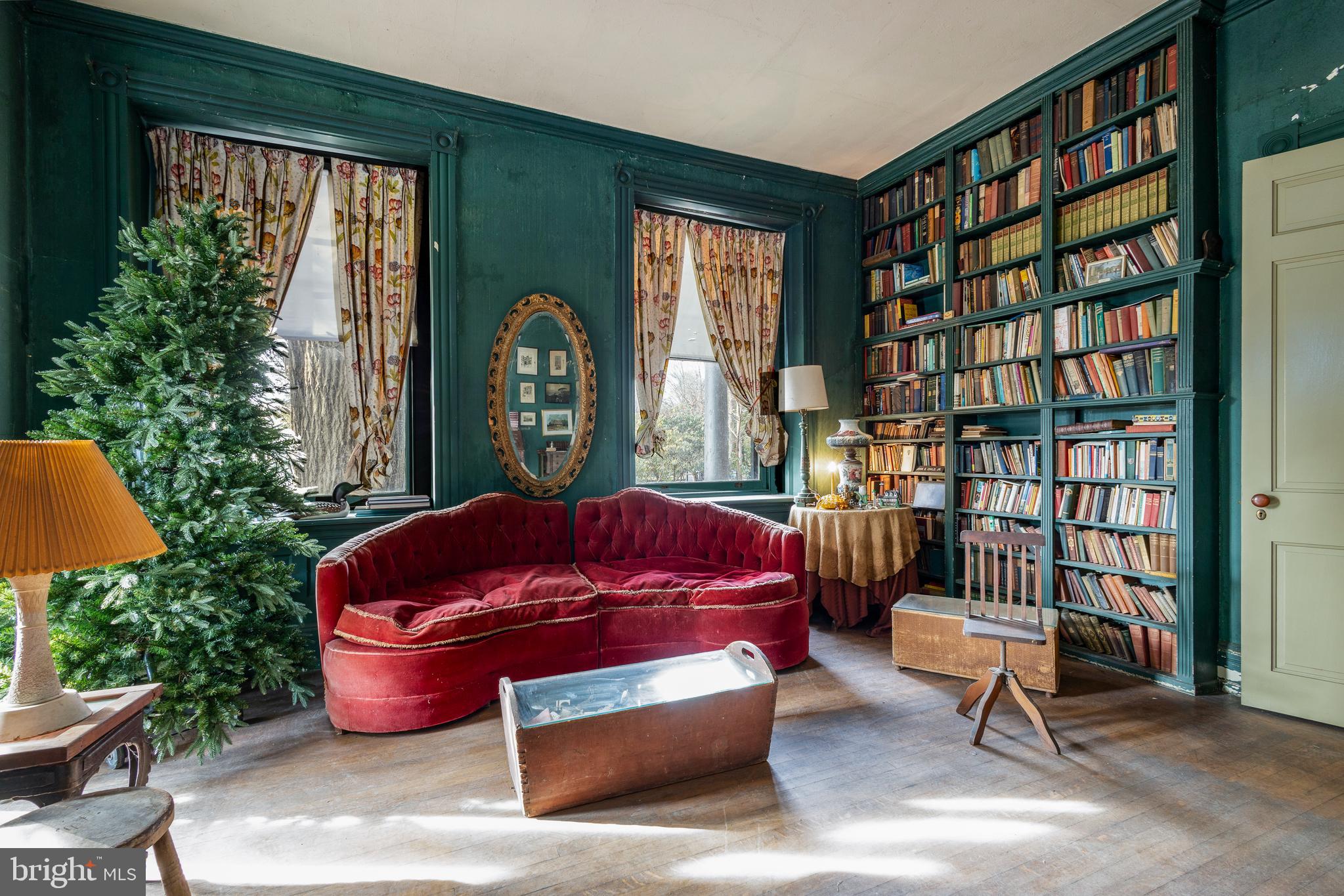 8221 Seminole Street Philadelphia, PA 19118 - Photo 2 of 20 a living room with furniture and a potted plant