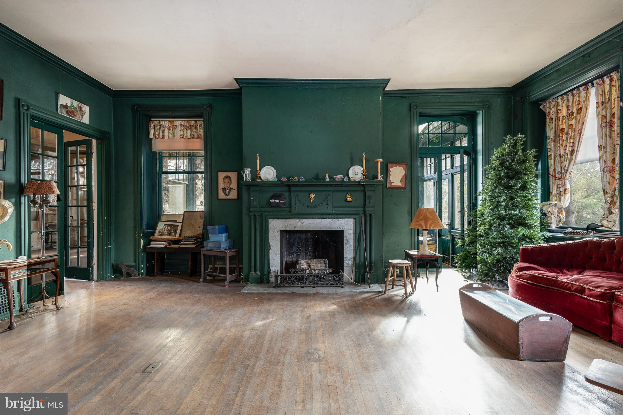 8221 Seminole Street Philadelphia, PA 19118 - Photo 4 of 20 a living room with furniture and a fireplace