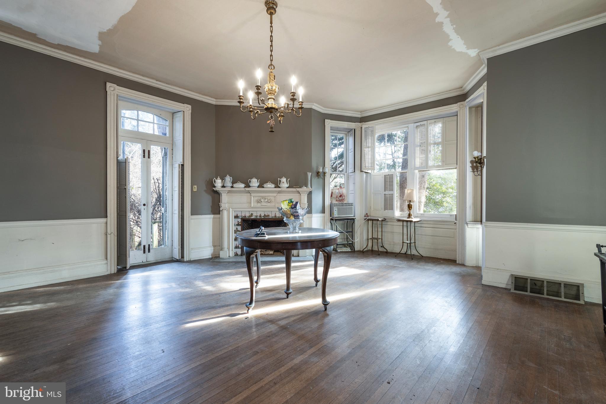 8221 Seminole Street Philadelphia, PA 19118 - Photo 10 of 20 a living room with furniture and a chandelier