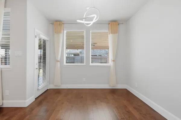 a spacious bathroom with a bathtub sink double and mirror