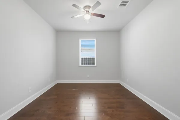 a view of a hallway with closet and bathroom