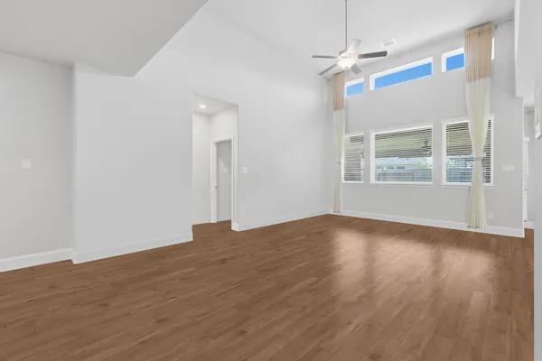 a view of a kitchen with wooden floor