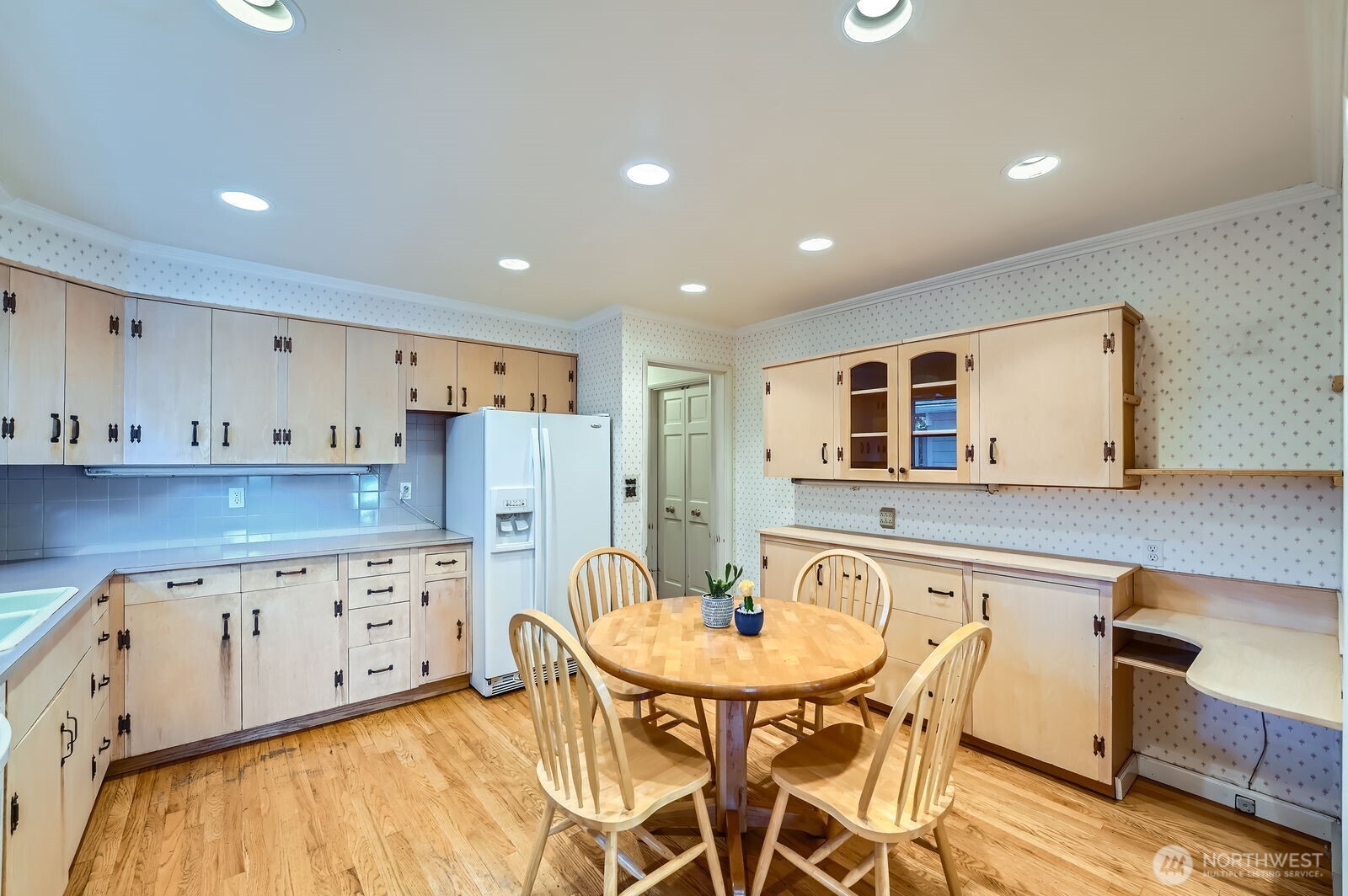 3706 84th Avenue Southeast Mercer Island, WA 98040 - Photo 13 of 38 a kitchen with stainless steel appliances granite countertop a kitchen island a white cabinets a sink and a refrigerator