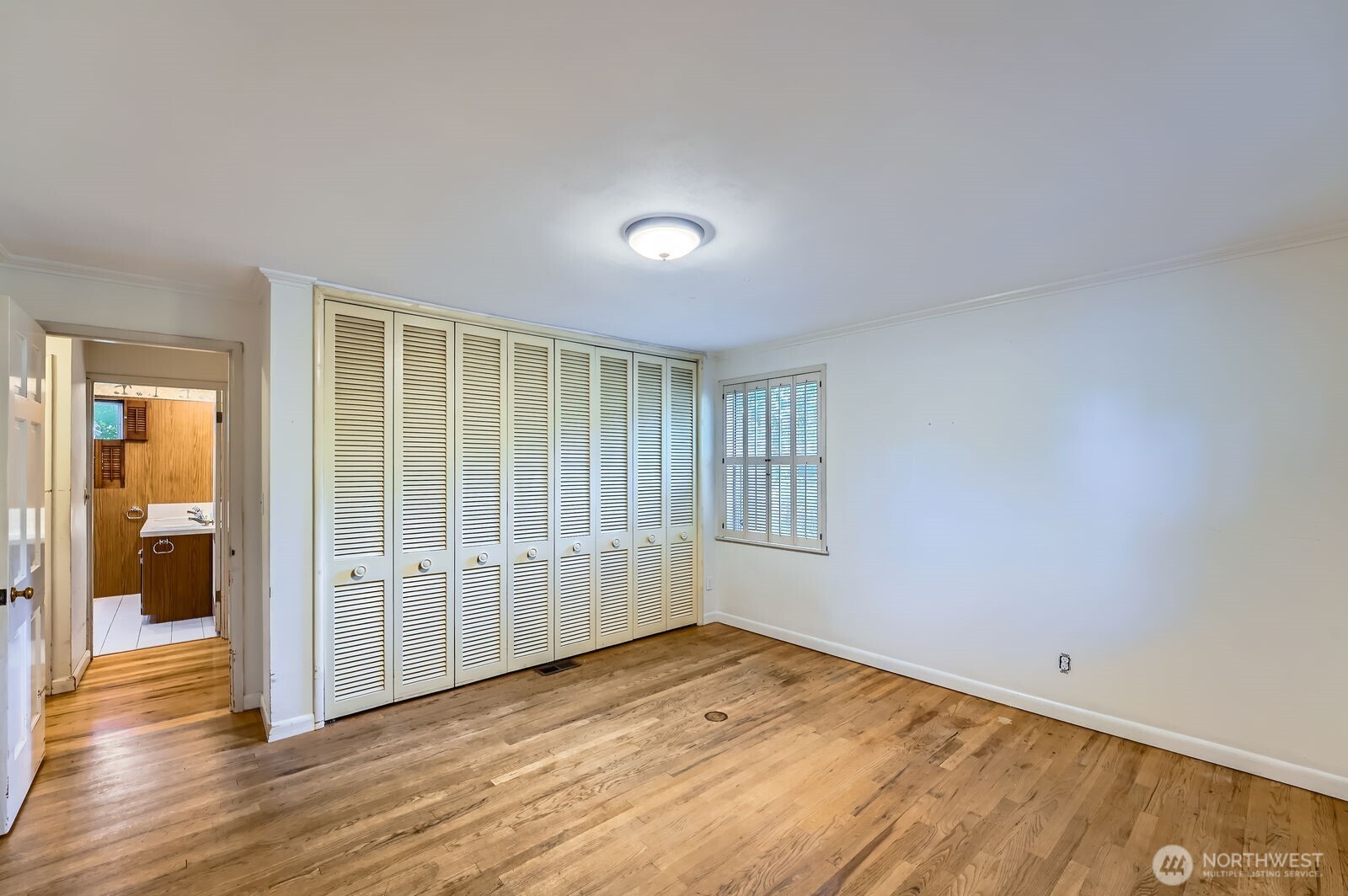 3706 84th Avenue Southeast Mercer Island, WA 98040 - Photo 18 of 38 an empty room with wooden floor and windows