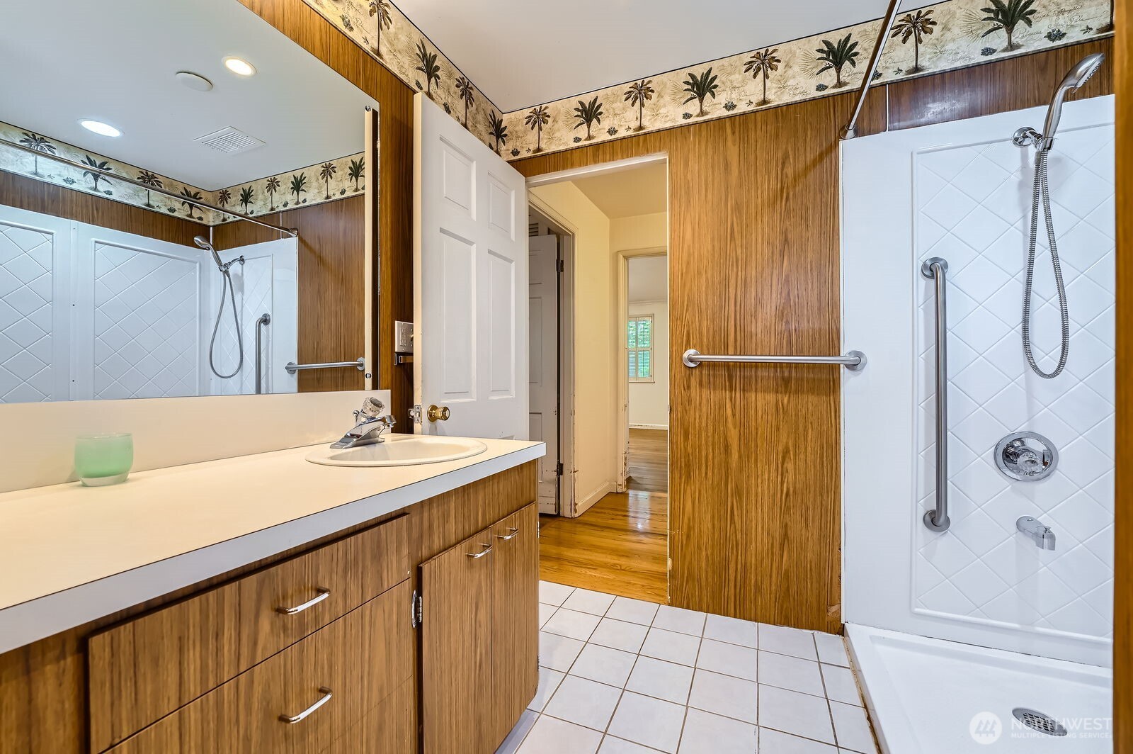 3706 84th Avenue Southeast Mercer Island, WA 98040 - Photo 19 of 38 a bathroom with a sink and a mirror