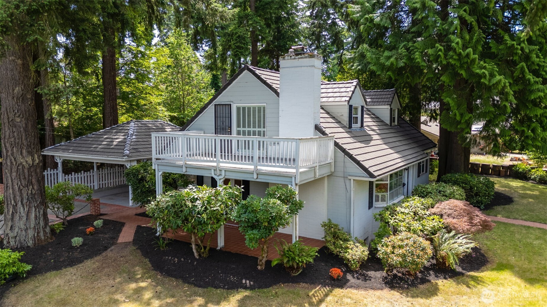 3706 84th Avenue Southeast Mercer Island, WA 98040 - Photo 2 of 38 a front view of a house with a yard and outdoor seating