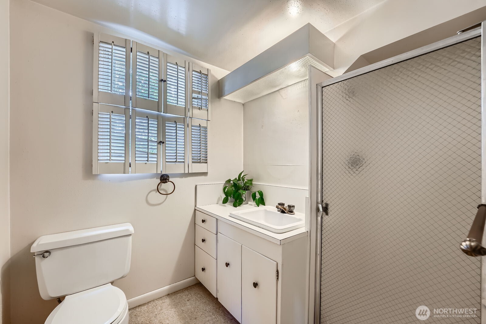 3706 84th Avenue Southeast Mercer Island, WA 98040 - Photo 26 of 38 a bathroom with a toilet a sink and a shower