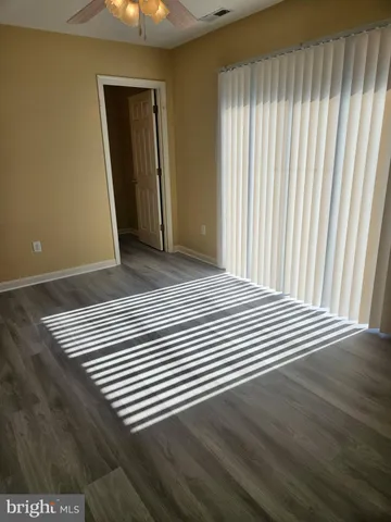 an empty room with wooden floor