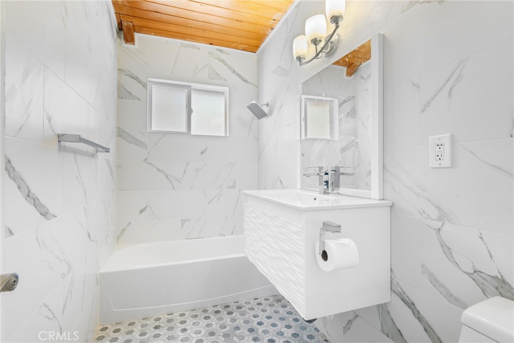 4225 Alcot Trail Frazier Park, CA 93225 - Photo 12 of 31 a bathroom with a sink a toilet and shower