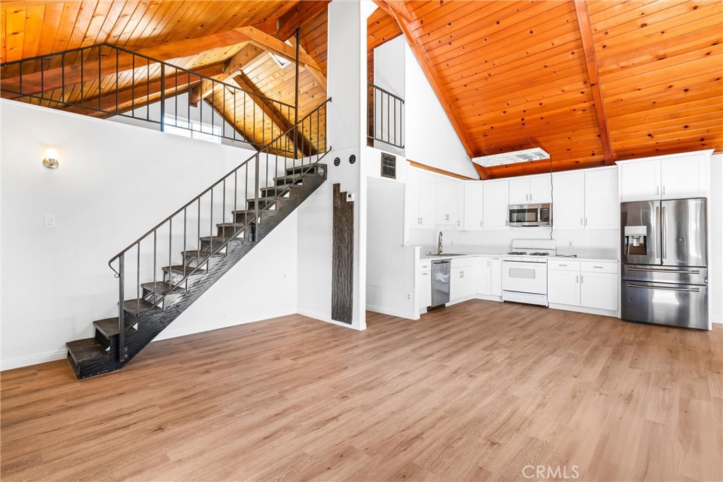 4225 Alcot Trail Frazier Park, CA 93225 - Photo 3 of 31 a view of a kitchen with wooden floor and a kitchen