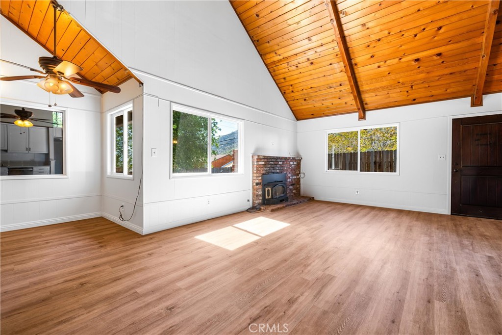 4225 Alcot Trail Frazier Park, CA 93225 - Photo 6 of 31 a view of a porch with wooden floor and fence