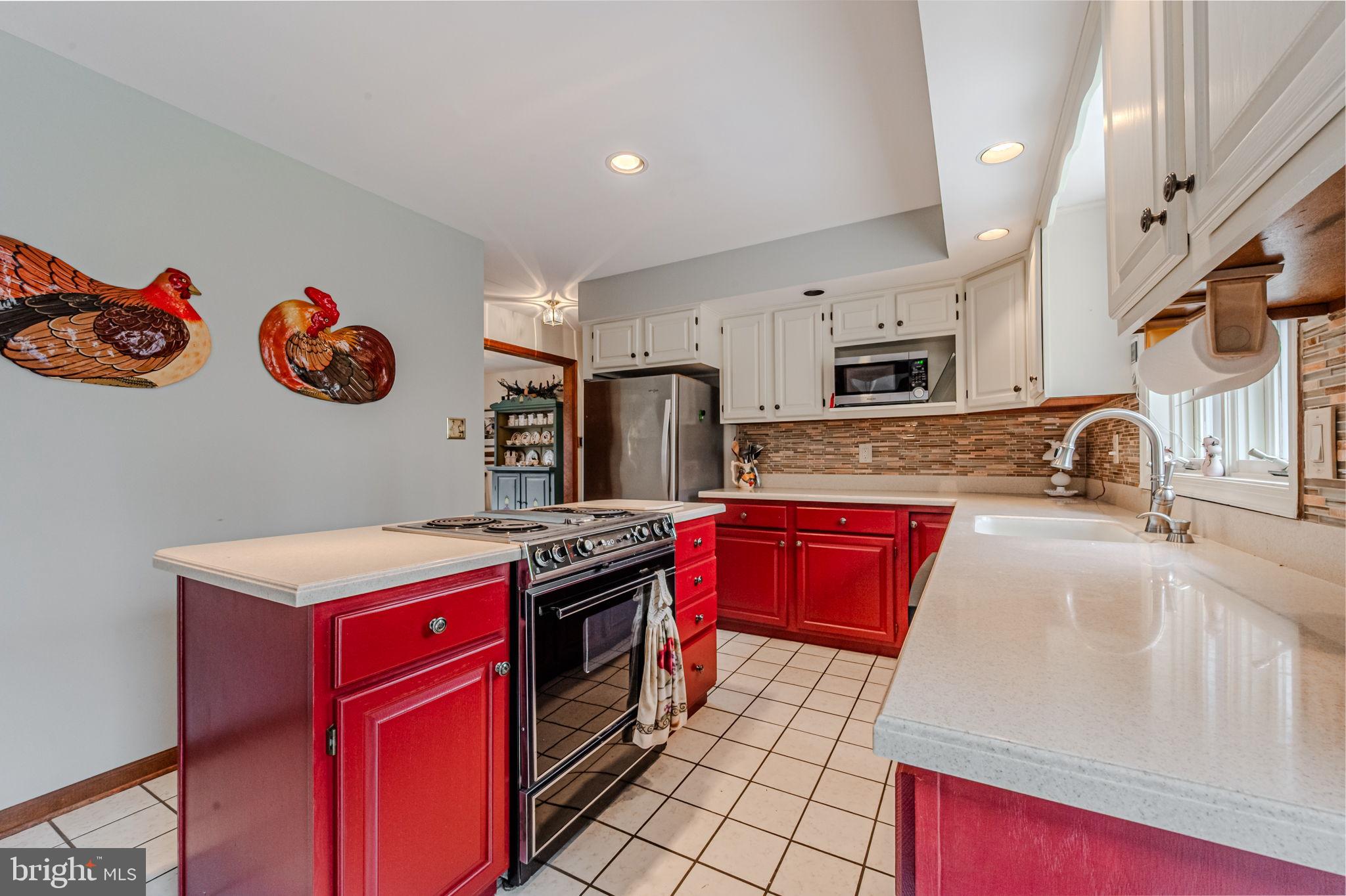 53 Bullock Road Chadds Ford, PA 19317 - Photo 16 of 65 a kitchen with stainless steel appliances granite countertop a stove sink and cabinets
