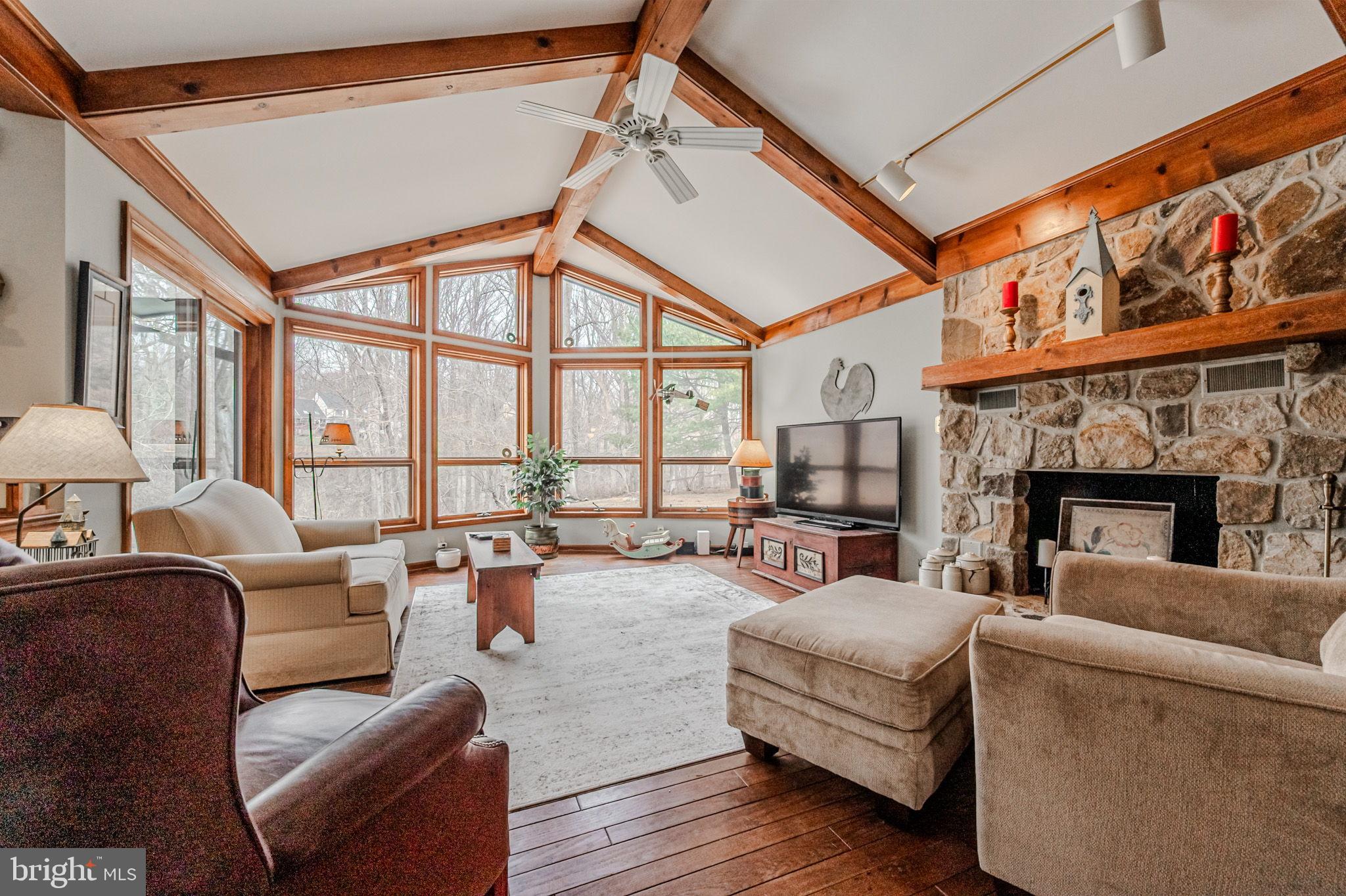 53 Bullock Road Chadds Ford, PA 19317 - Photo 10 of 65 a living room with furniture a fireplace and a large window