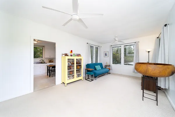 a view of a livingroom with furniture and a large window